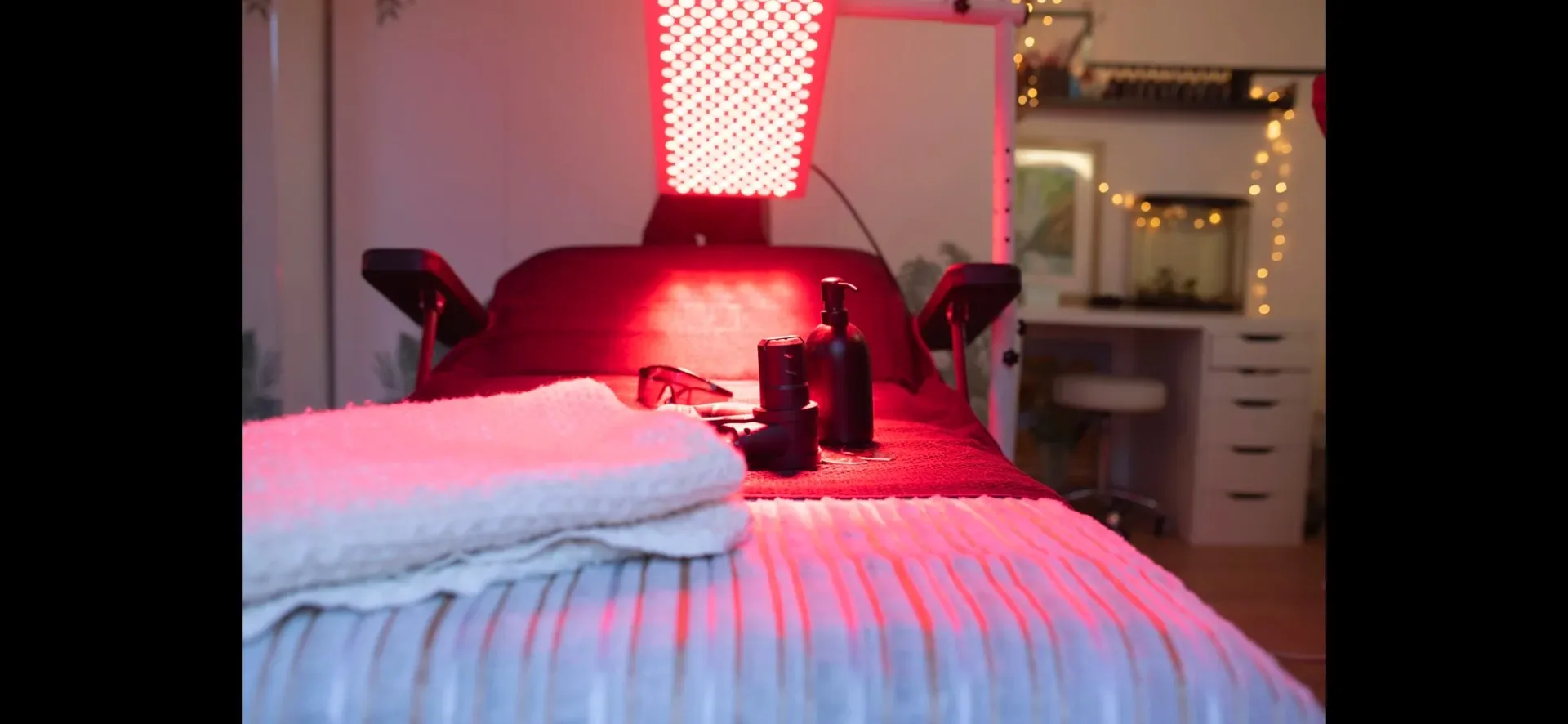 Red-light treatment bed prepared for a session in the Hope House room